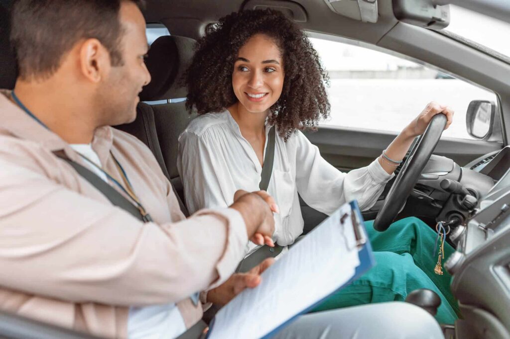 Instructor Handshaking With Driver Lady After Succ 2023 05 11 20 24 41 Utc.jpg